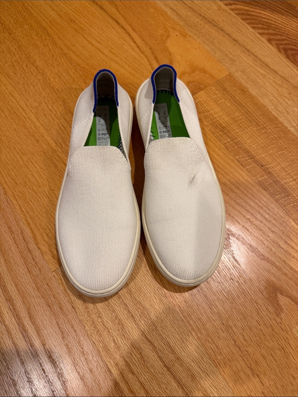 Rothy's White Slip-On Knit Sneakers with Blue Heel Trim